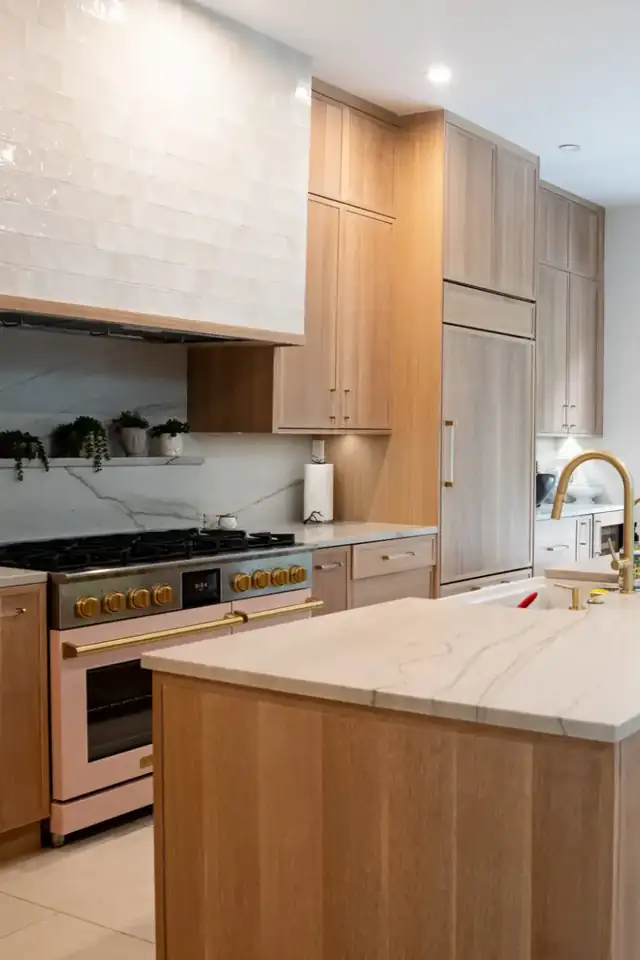 Kitchen remodel with white oak cabinets, quartzite island, zellige-style tile hood wall and pro range